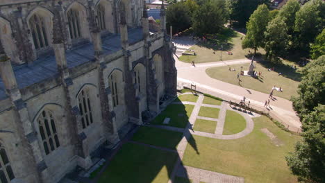 drone shot of the south side of winchester cathedral and grounds, captured in summer, in hampshire, uk