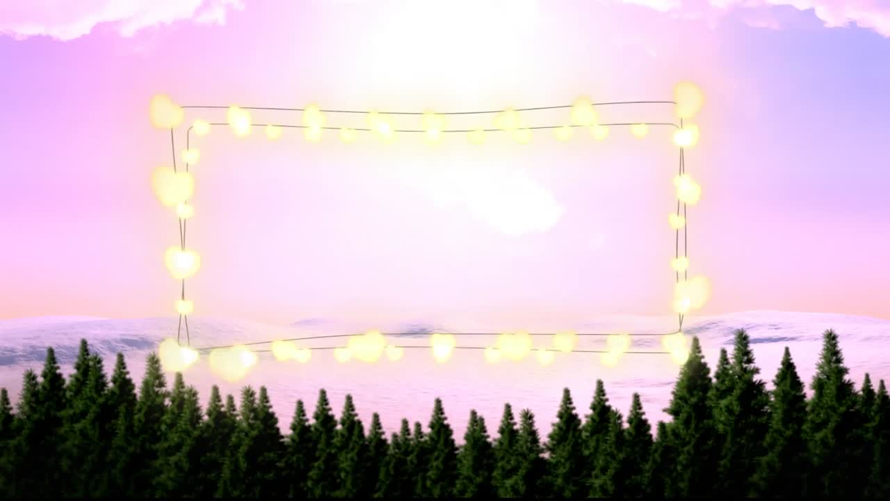 Animation of fairy light frame with copy space over fir trees and winter scenery