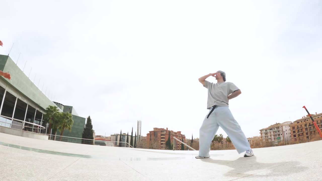 Breakdancer performing acrobatics in urban setting
