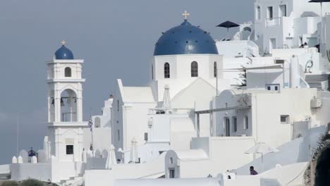 blue church domes in santorini