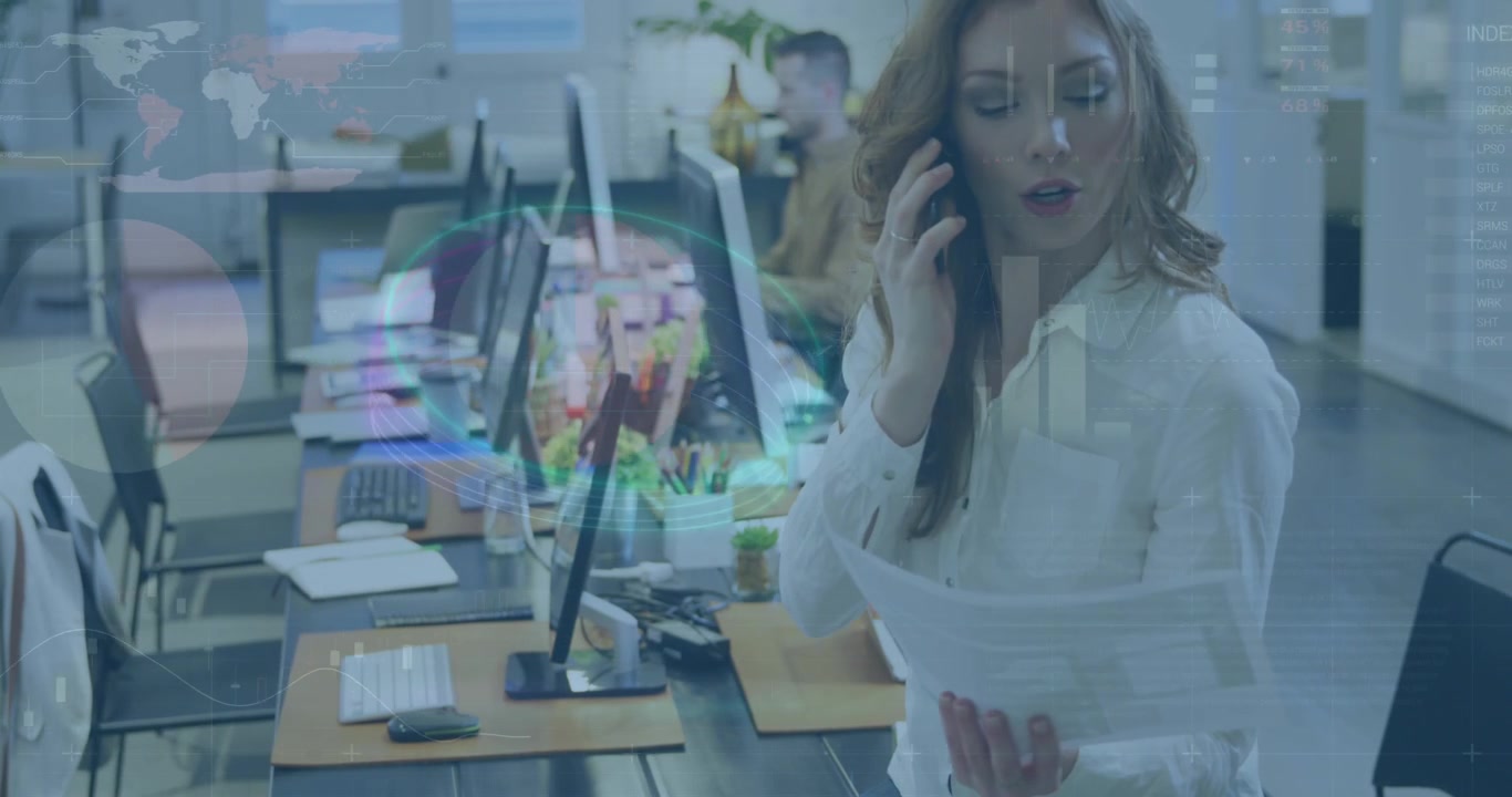 Businesswoman Talking on Phone While Reviewing Documents in Modern Office
