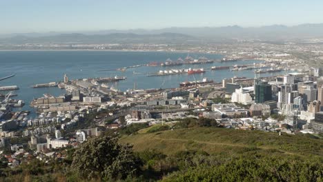 high angle pan across city center and shipping terminal in cape town