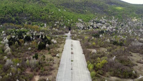 runway at zeljava air base at the gola pljesevica mountain in croatia. - aerial shot