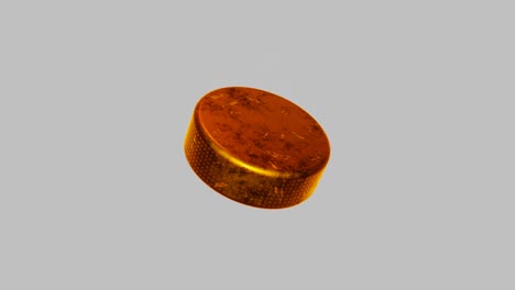 golden hockey puck on white background.