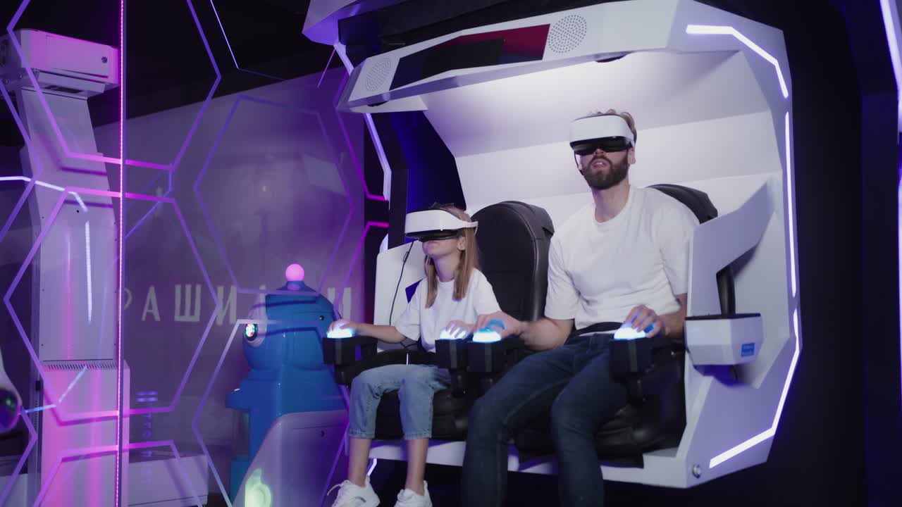 Father and daughter experience virtual reality simulator