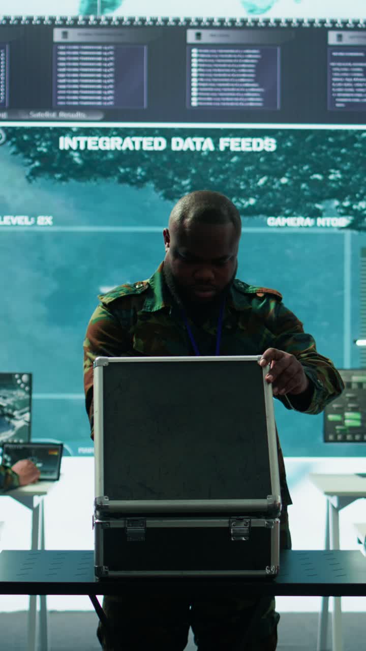 Vertical Video Military expert in a control center uses advanced technology and modern gear