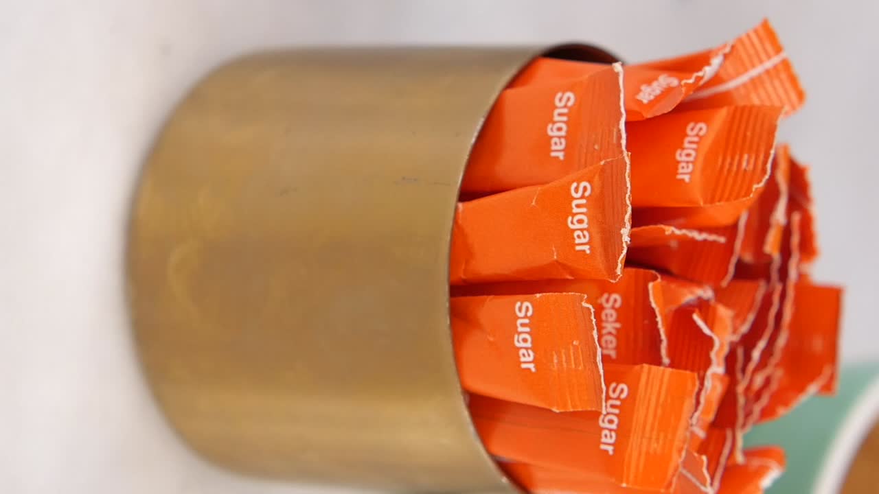 Sugar packets in a container