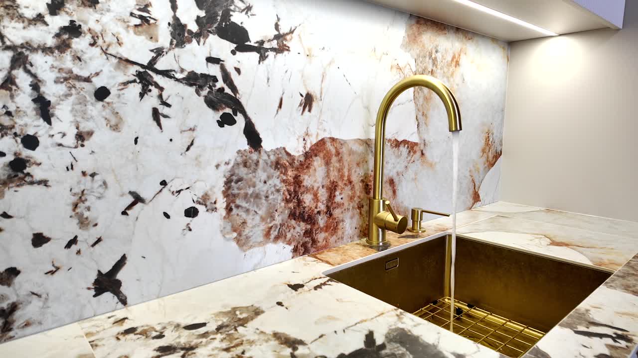 Modern kitchen sink with brass faucet and marble countertops