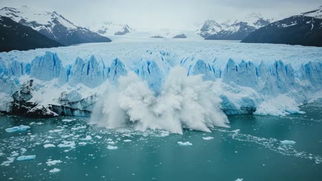 a stunning glacial collapse: the dramatic transformation of frozen ice into water as a massive glacier calves into the ocean, capturing nature’s mighty power