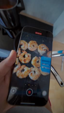 recording shrimp cooking on a smartphone