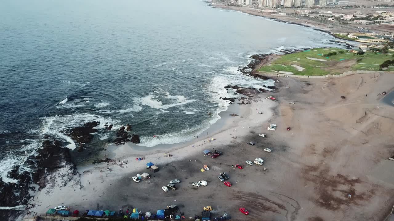 Tilt Up Aerial View of Pacific Ocean Coastline and Antofagasta City, Chile, Atacama Desert