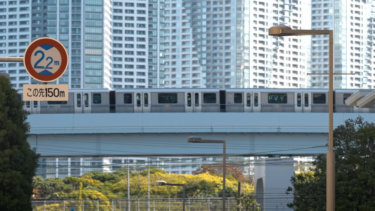 A train moves across a bridge in Tokyo, Japan, blending urban infrastructure with the dynamic energy of the city.