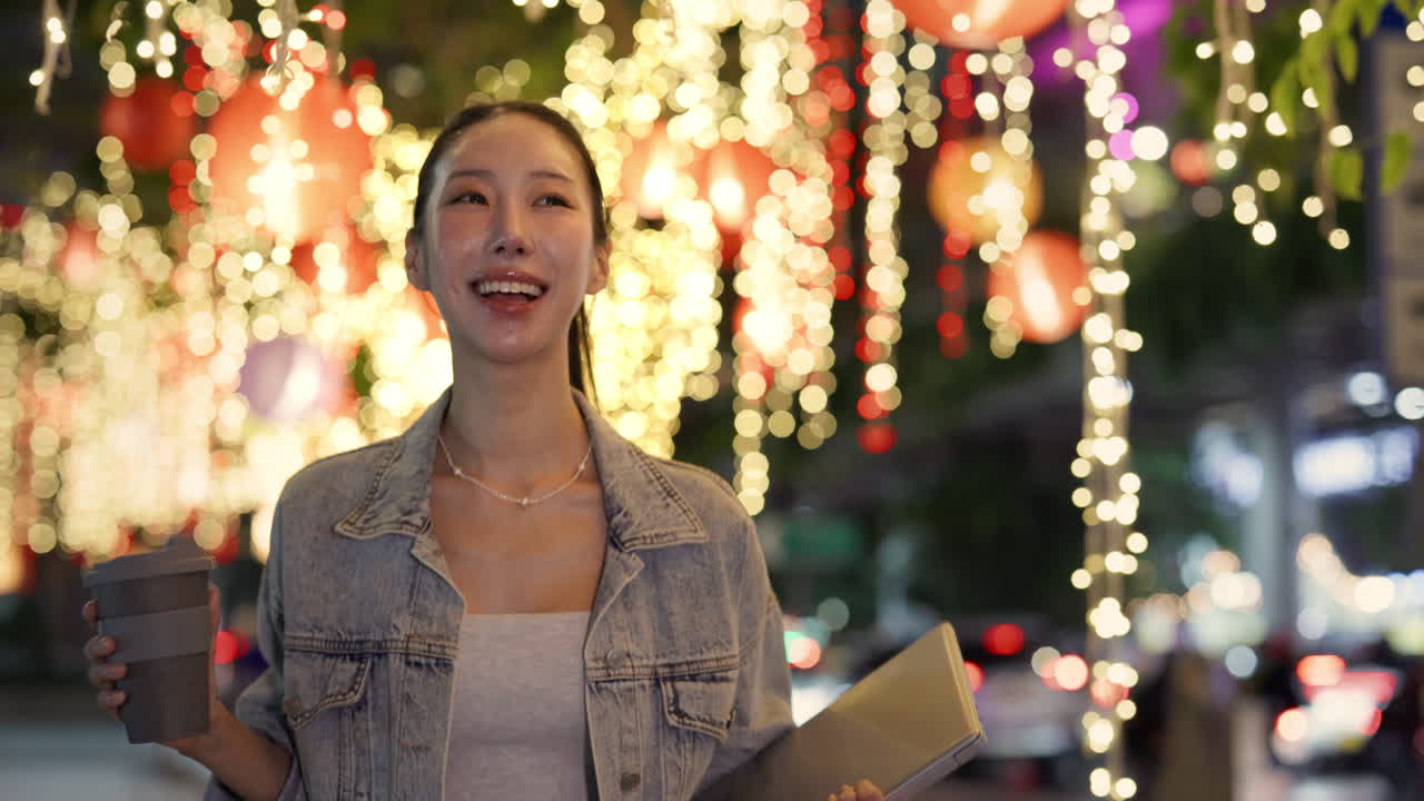 Woman with Laptop and Coffee Cup at Night