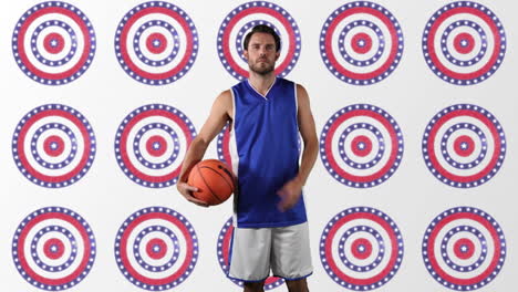 caucasian male basketball player holding basketball against multiple stars on spinning circles