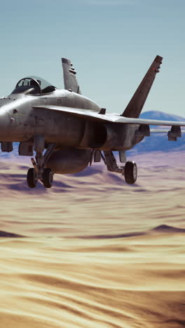 fighter jet flying over desert landscape