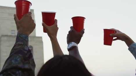 young adult friends hanging out on a rooftop