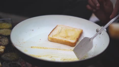 cooking bread with butter in outdoors