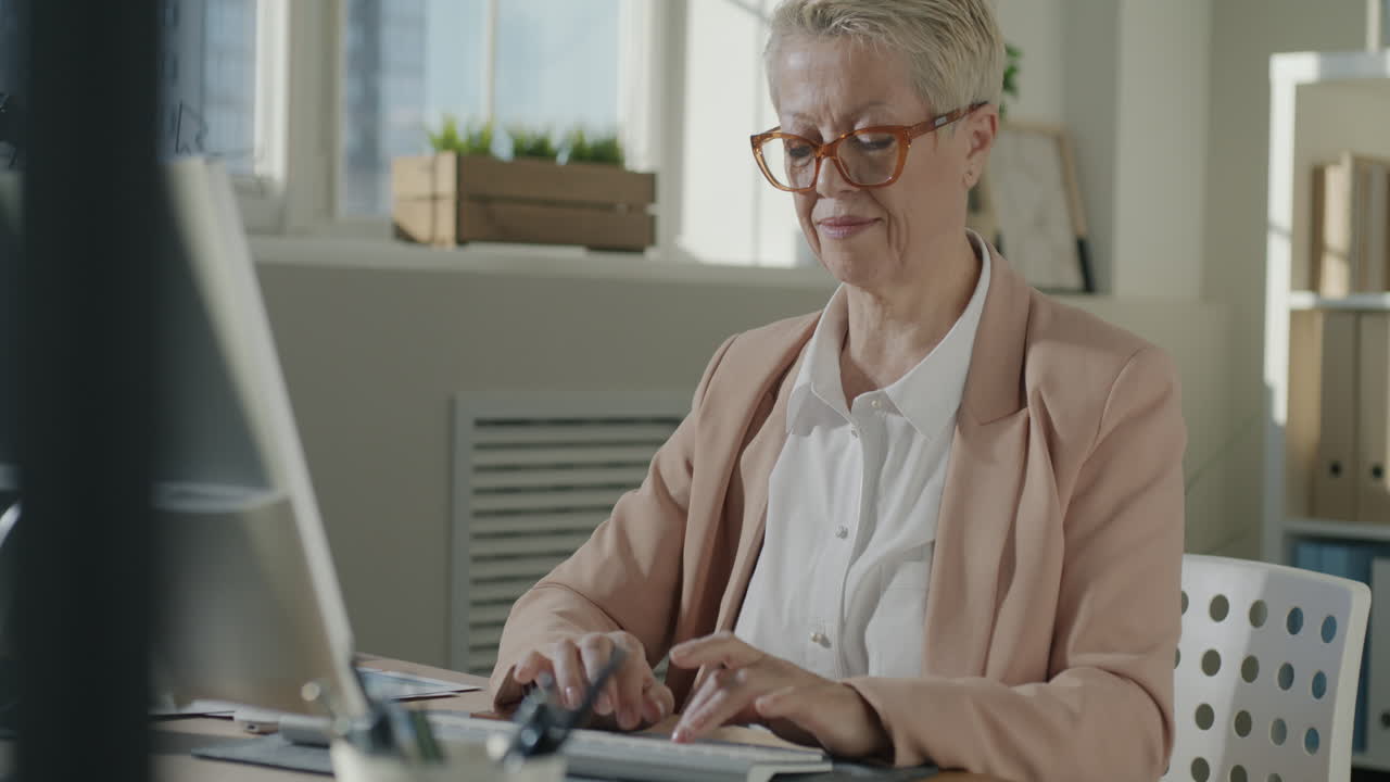 Businesswoman Working at Computer