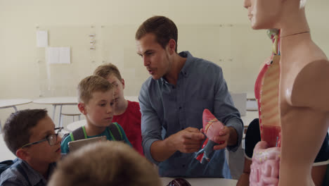 male teacher teaching human anatomy in the class