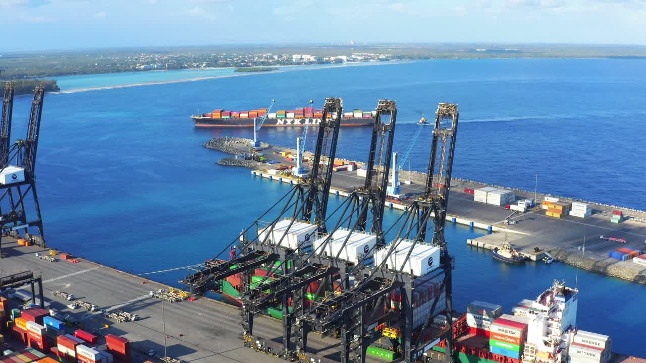 Cargo ship at Caucedo DP world port, Dominican Republic. Aerial circling