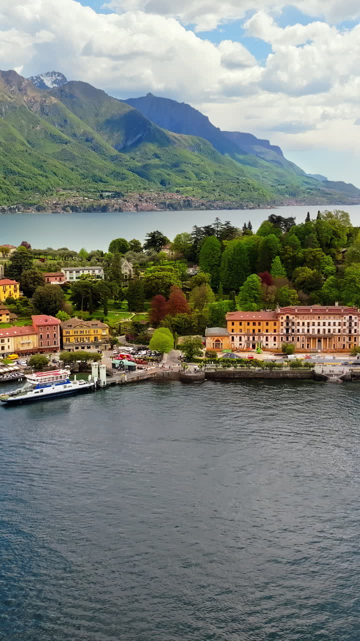 Aerial drone view of the village Bellagio on the shore of Lake Como, Italy. Vertical