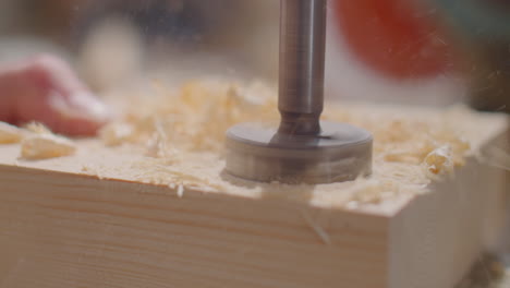 drilling hole in wood with hole saw