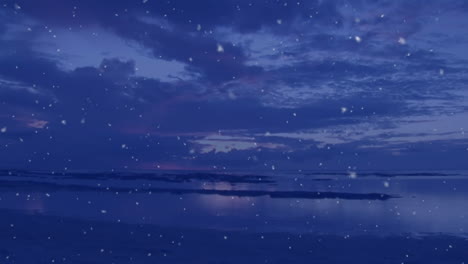 snowfall animation over serene ocean landscape at dusk