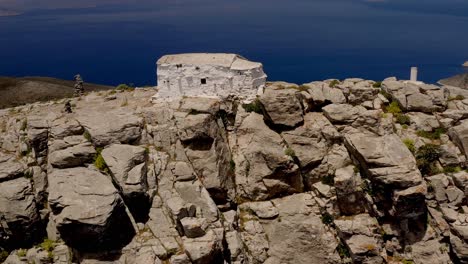 small orthodox church high on a rocky peak, greece