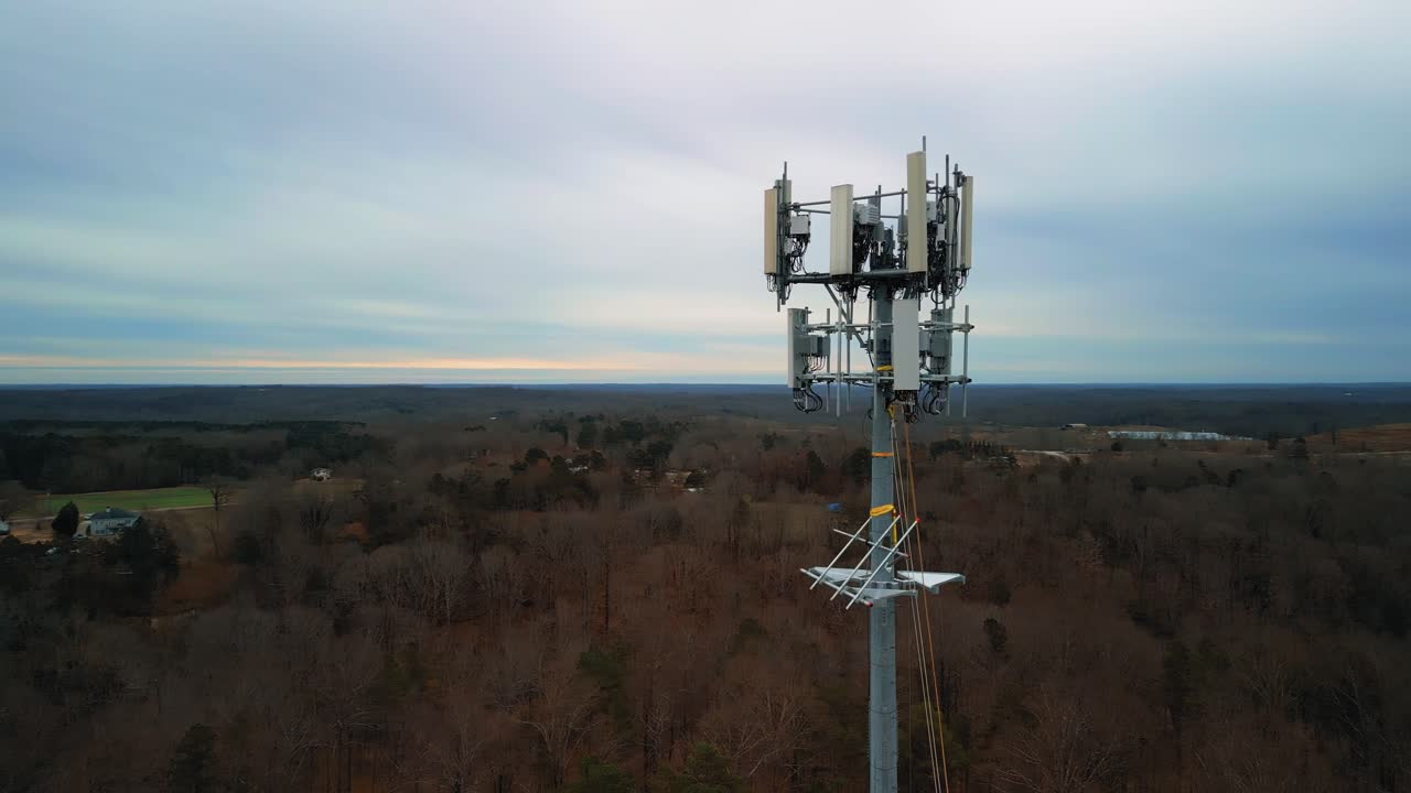 Aerial Shot Rotating Around Cell Phone Tower Surrounded by Nature. 4K Drone Footage
