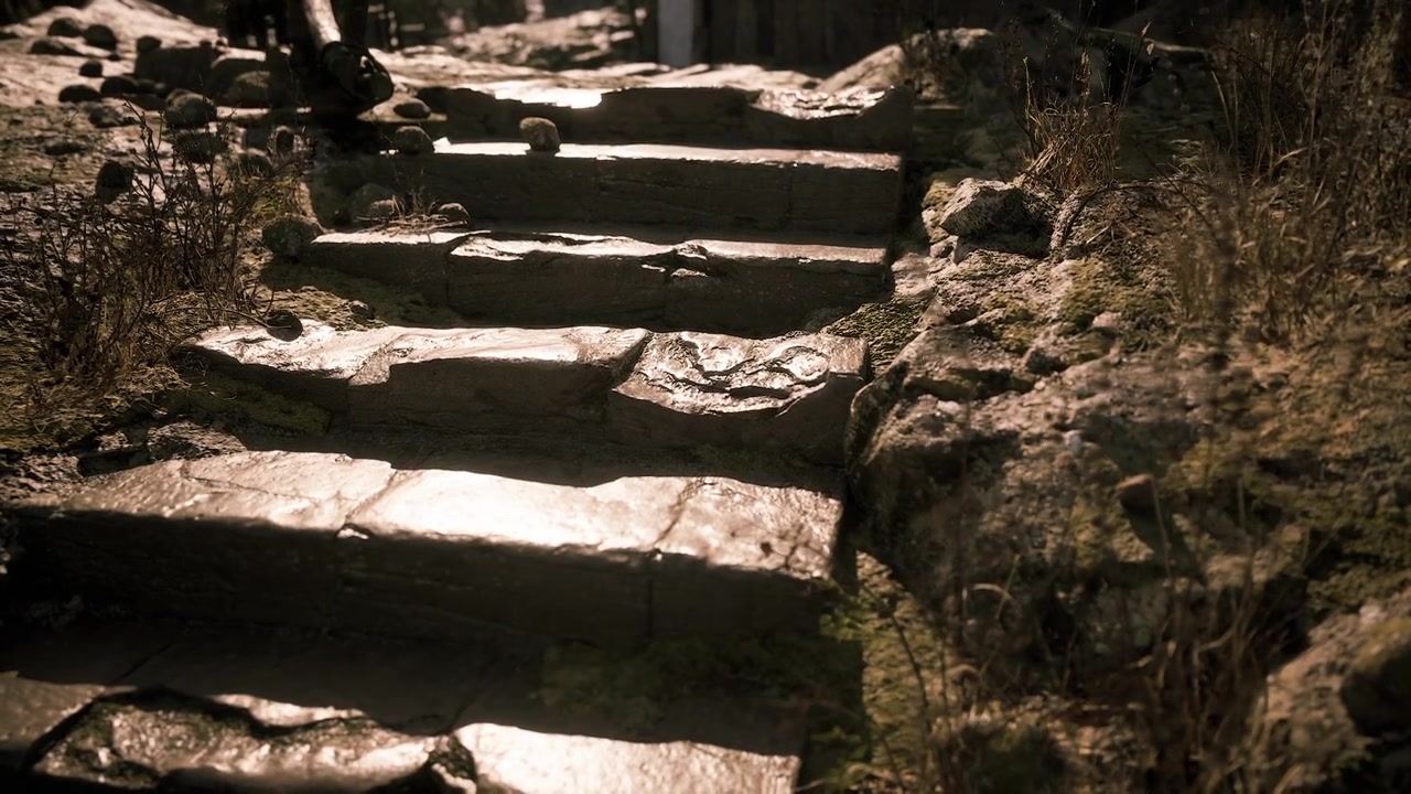 Steep and weathered stone steps in a rural outdoor setting