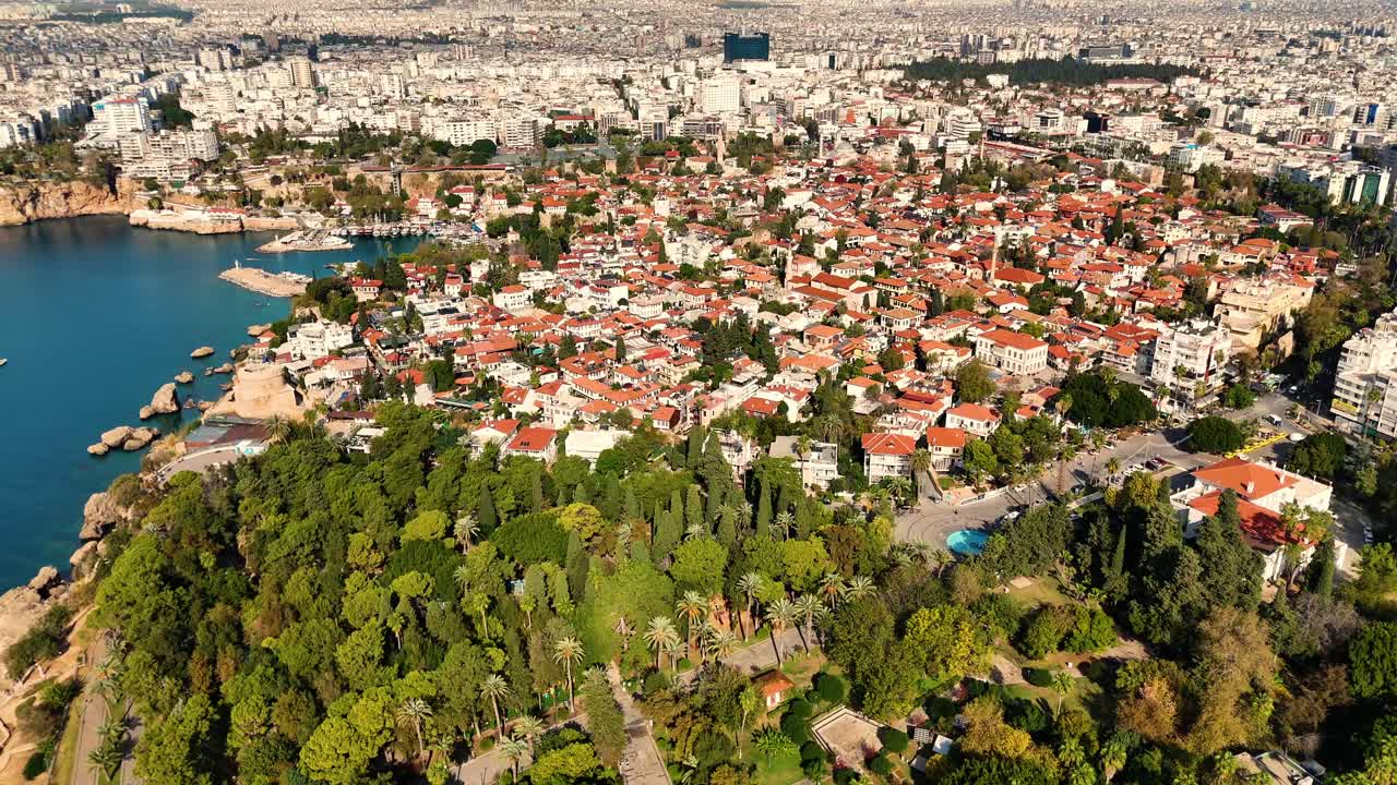 Aerial view of Karaalioglu Park, showcasing lush greenery as it leads into the historic charm of Antalya's Old Town, Turkey.