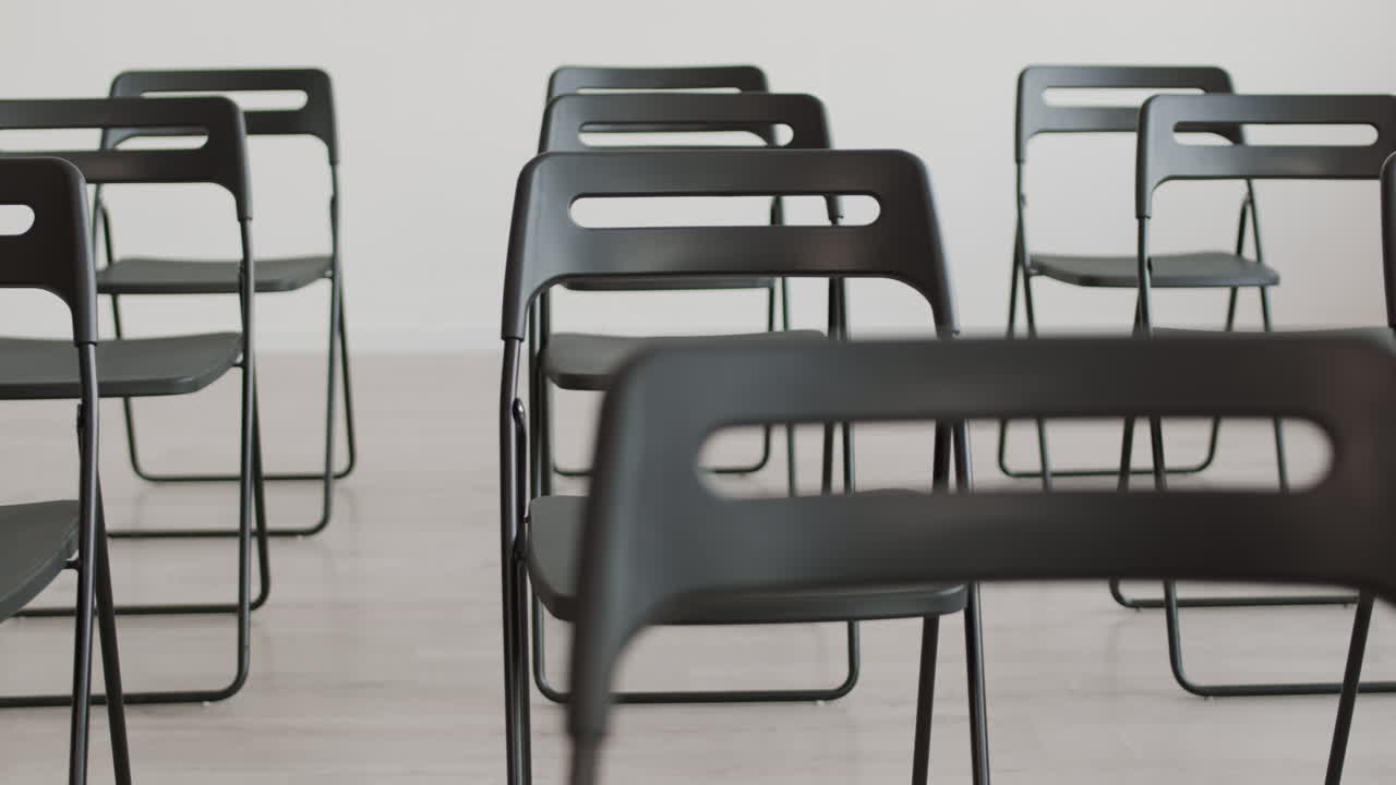 Black Folding Chairs in Conference Room