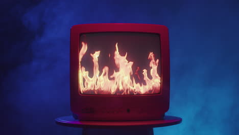 retro tv with burning flames on screen