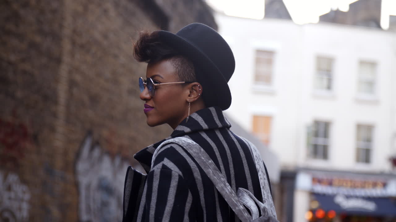Stylish Fashion Blogger Walking Along Urban Street