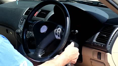 Man Starting a Car