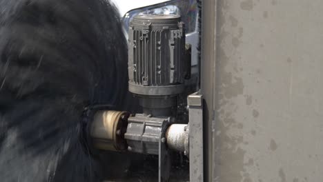 close up of a rotating foam car wash brush