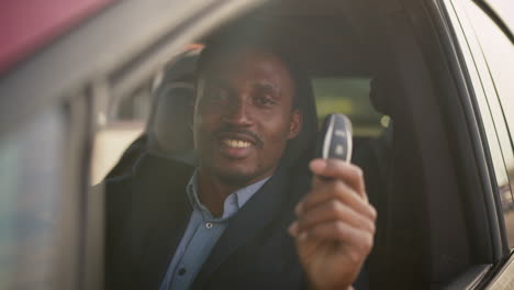 happy man receiving car keys