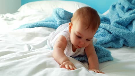 Cute-baby-girl-playing-on-bed