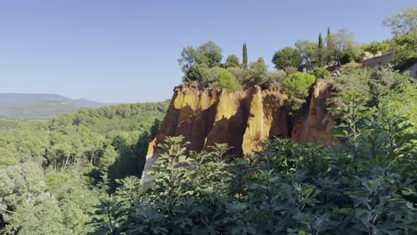 colored-rocks-for-extracting-color-in-France-in-front-of-a-beautiful-wide-landscape-in-good-weather