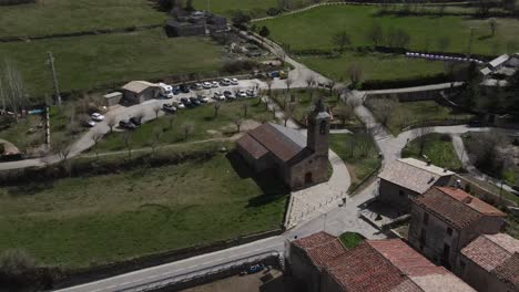 aerial views of an old village with a romanesque church in the pyrenees in spain