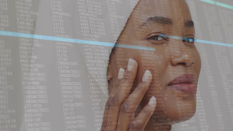 Touching-face-and-smiling,-woman-over-data-processing-animation-with-redacted-text