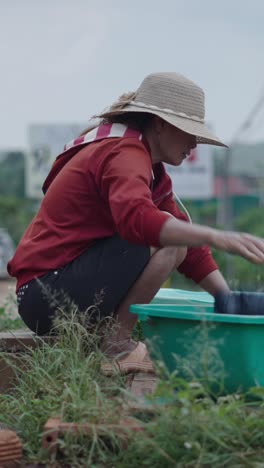 Woman Washing Clothes Outdoors