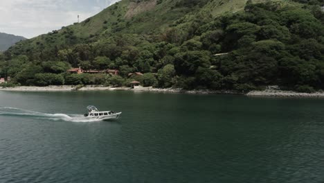 speedboat navigates on atitlan lake, guatemala