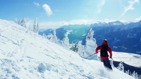 Person-snowboarding-on-snowy-mountain