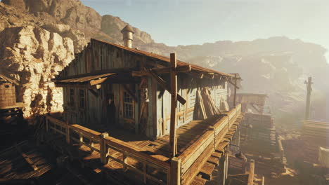 abandoned wooden cabin in a mountainous desert landscape