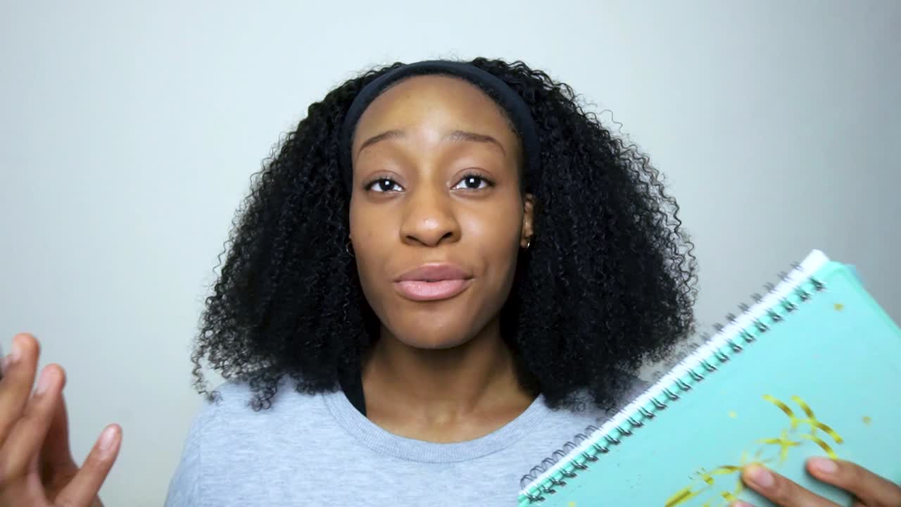 Young Student Presenting and Talking Directly into Camera