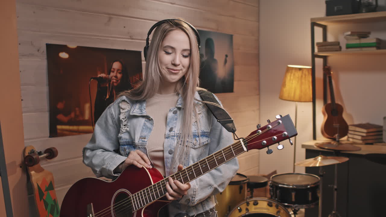 Portrait Of Young Smiling Female Guitarist