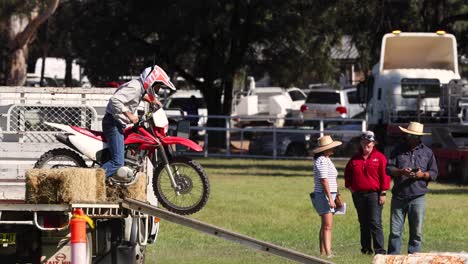 motorcyclist executing stunts over obstacles