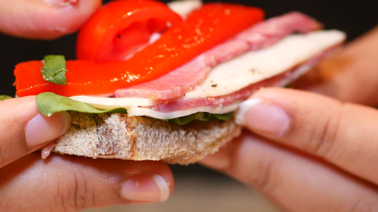 Open sandwich with meat, cheese, and vegetables