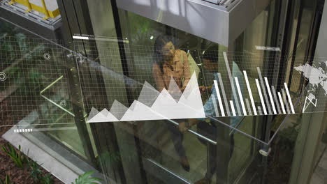 Animation-of-statistical-data-processing-over-diverse-man-and-woman-discussing-in-elevator-at-office